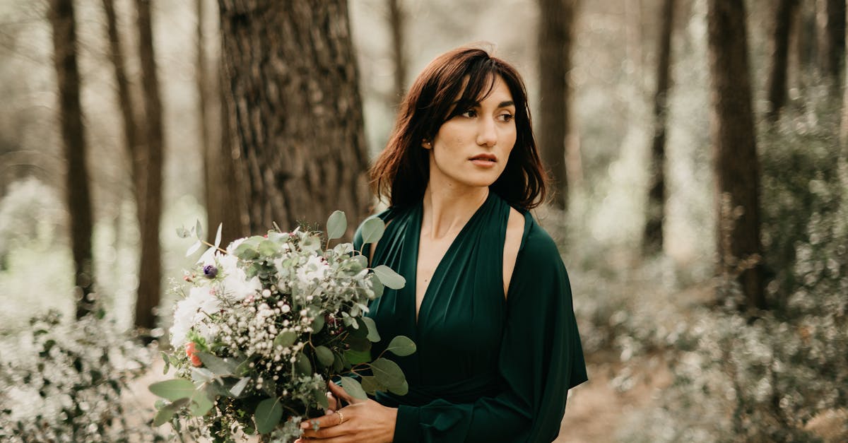 Woman Posing with Flowers in Forest