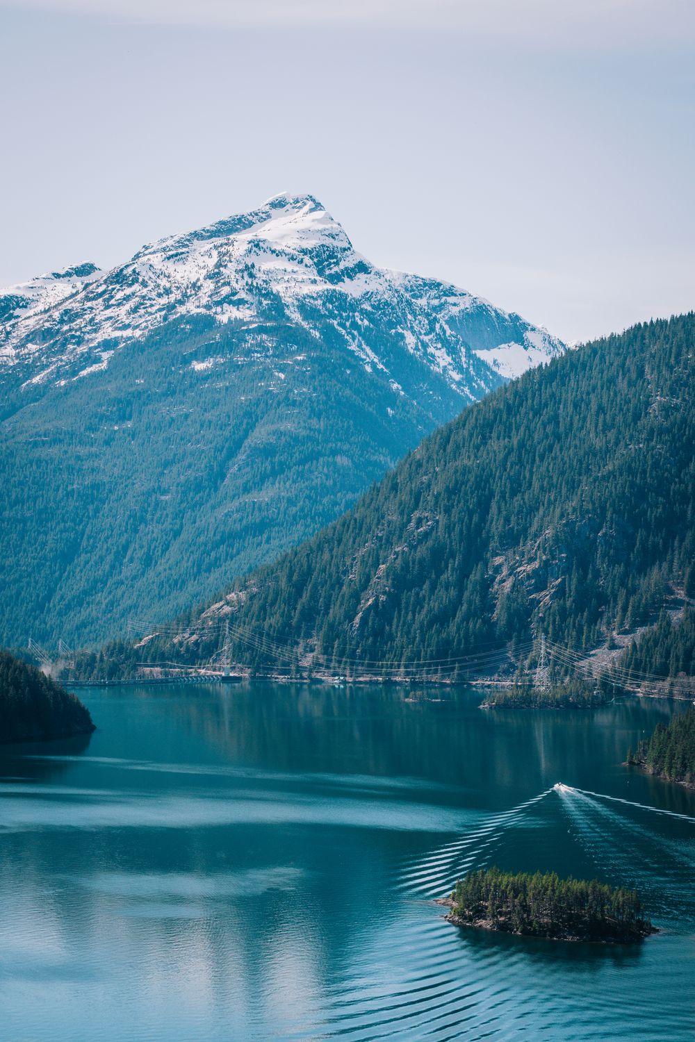 Beautiful view of snowcapped Cascade Mountains reflecting on Diablo Lake in Washington.