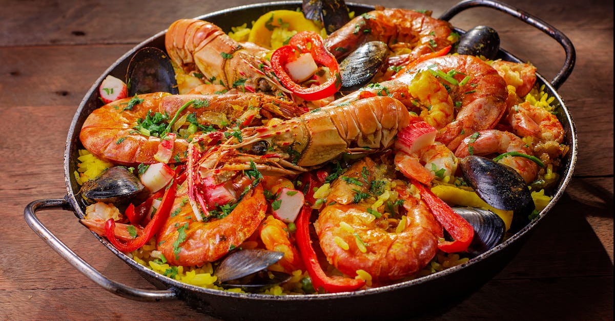 A colorful spread of assorted seafood dishes on a table, showcasing a variety of flavors and textures.