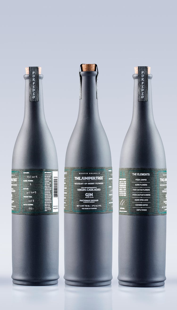 Matte Gin Bottles On Gray Background 