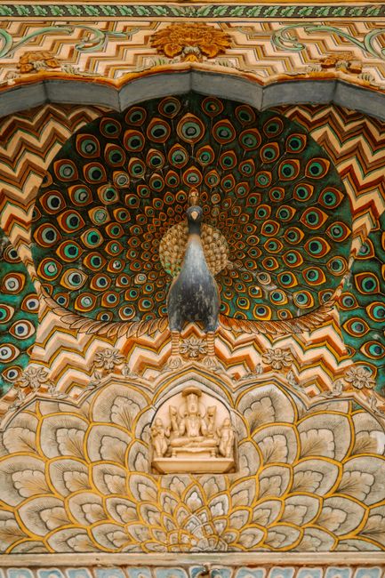 Close-up of the vibrant peacock design at Jaipur's City Palace, showcasing rich colors and artistry.