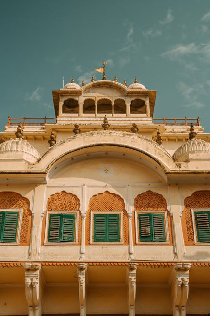 An elegant view of Jaipur's City Palace, featuring intricate architecture and traditional Indian design.