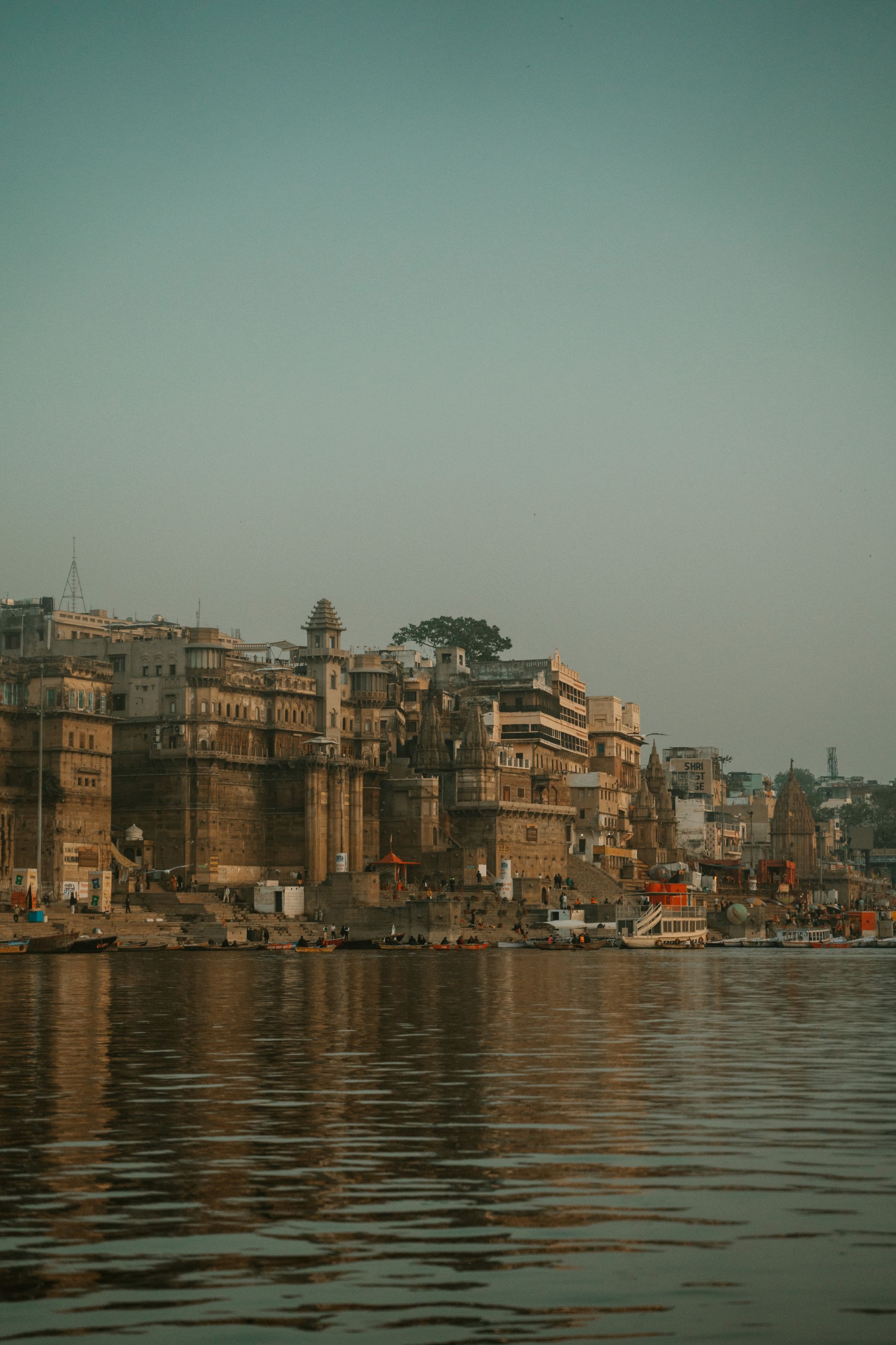 The Varanasi ghats and historic buildings along the Ganga at dawn
