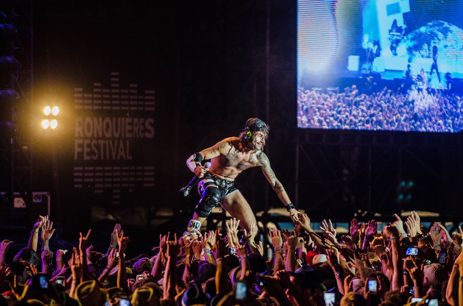 Dynamic live performance at Ronquières Festival capturing the energy of the crowd and musician.