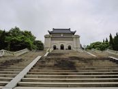 Majestic view of Dr. Sun Yat-sen's Mausoleum surrounded by greenery in Nanjing.