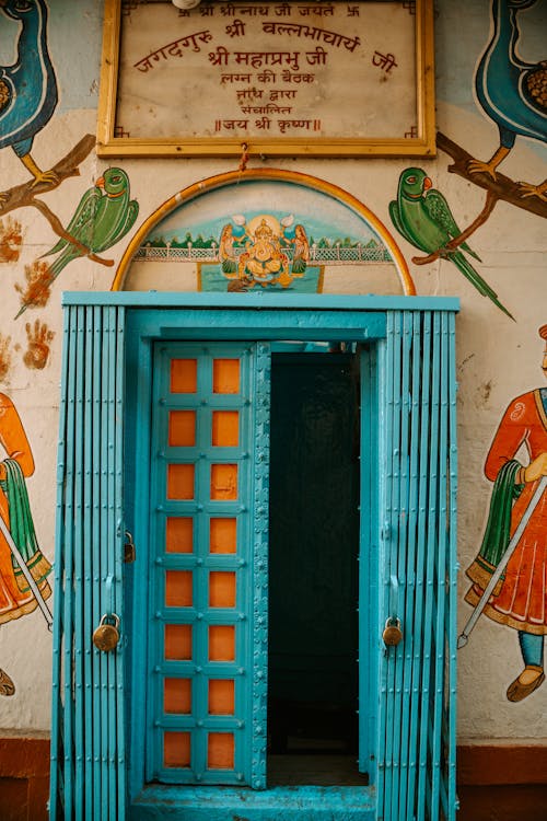 Blue Door and Grate of Entrance Decorated with the Image of Ganesha