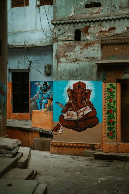 Paintings of Indian Gods on the Walls of Buildings in City 