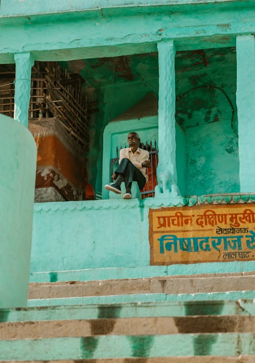 A Man Sitting on a Street in Varanasi