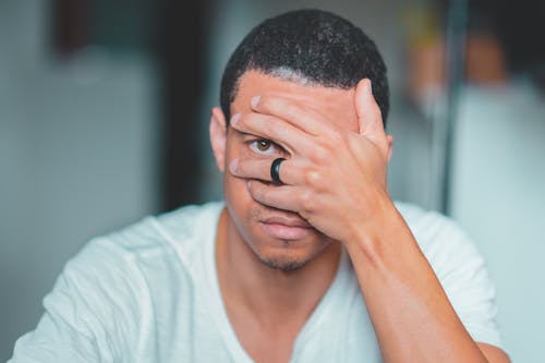 Free Photo of Man Covering His Face Stock Photo