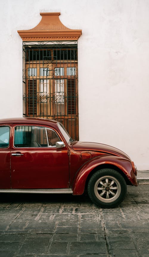 Burgundy Volkswagen Beetle Parked on the Street