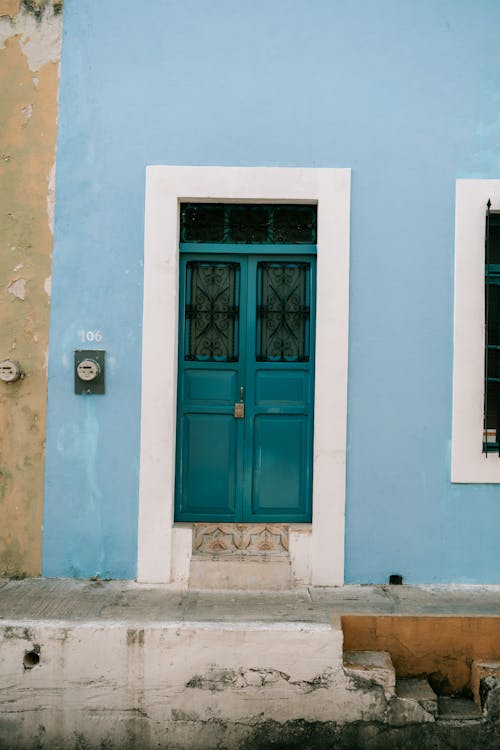 Building Facade with Blue Entrance Door 