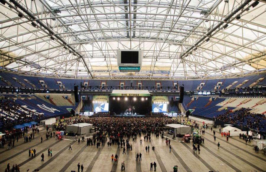 Wide view of a packed indoor arena, photo by Thibault Trillet on Pexels