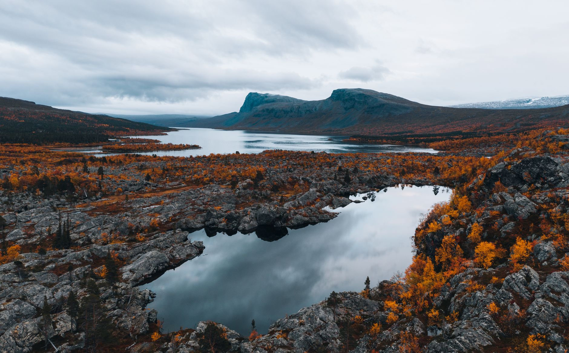 A stunning aerial view of autumn foliage and lakes in Norrbotten County, Sweden.