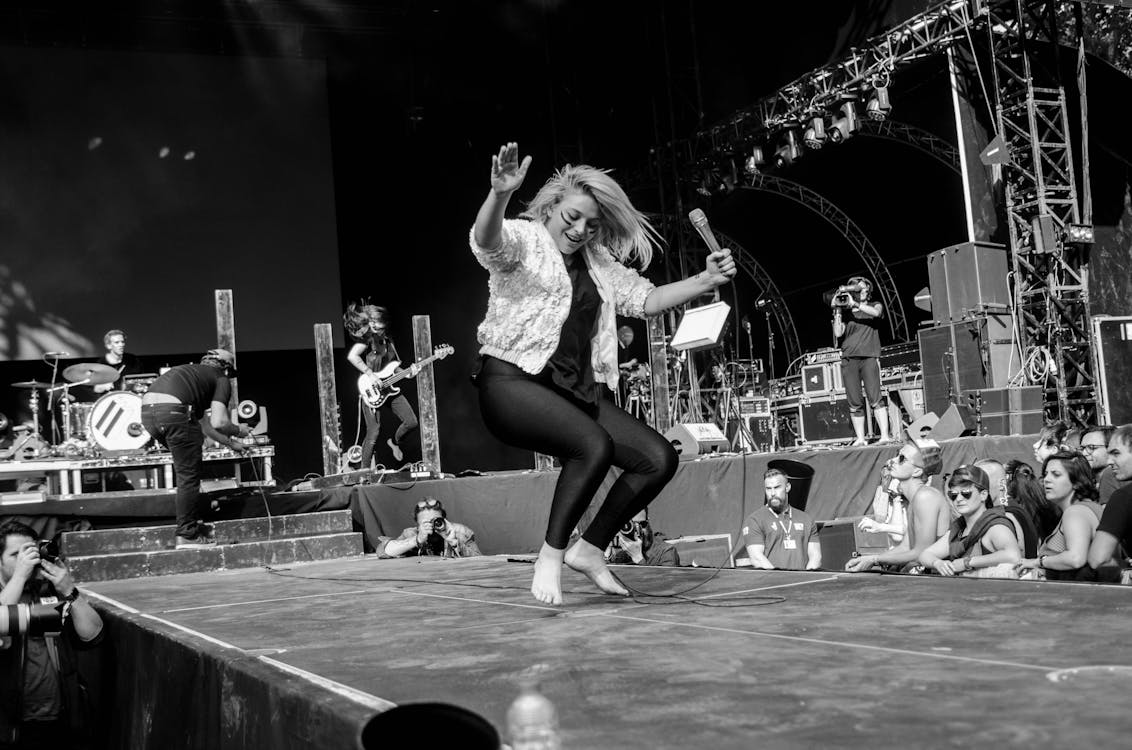 Free Women Dancing on Stage in Gray Scale Photography Stock Photo