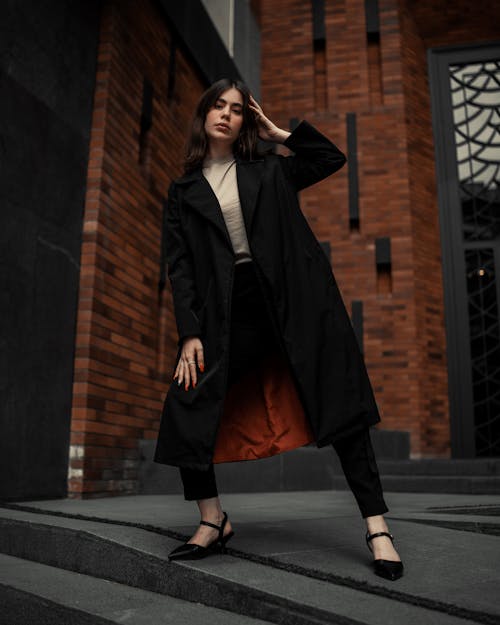 Woman Posing in Black Coat