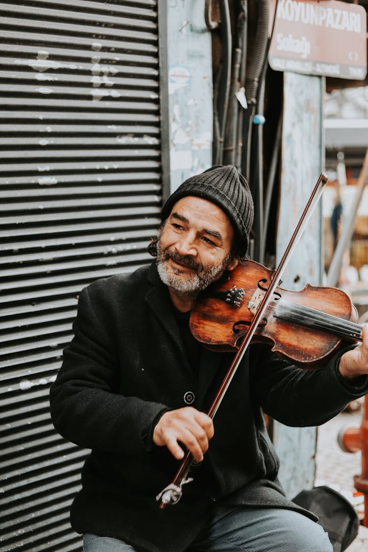 Old Bearded Man Playing On Violin On Street