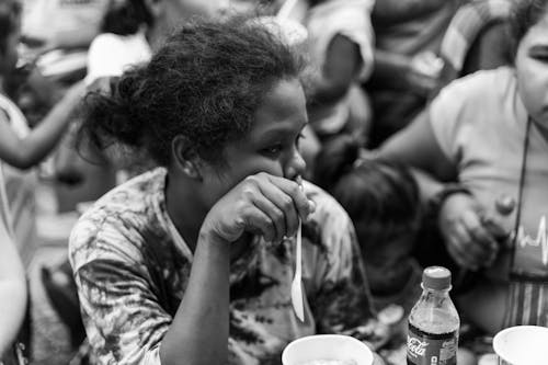 Woman with Spoon at Bar