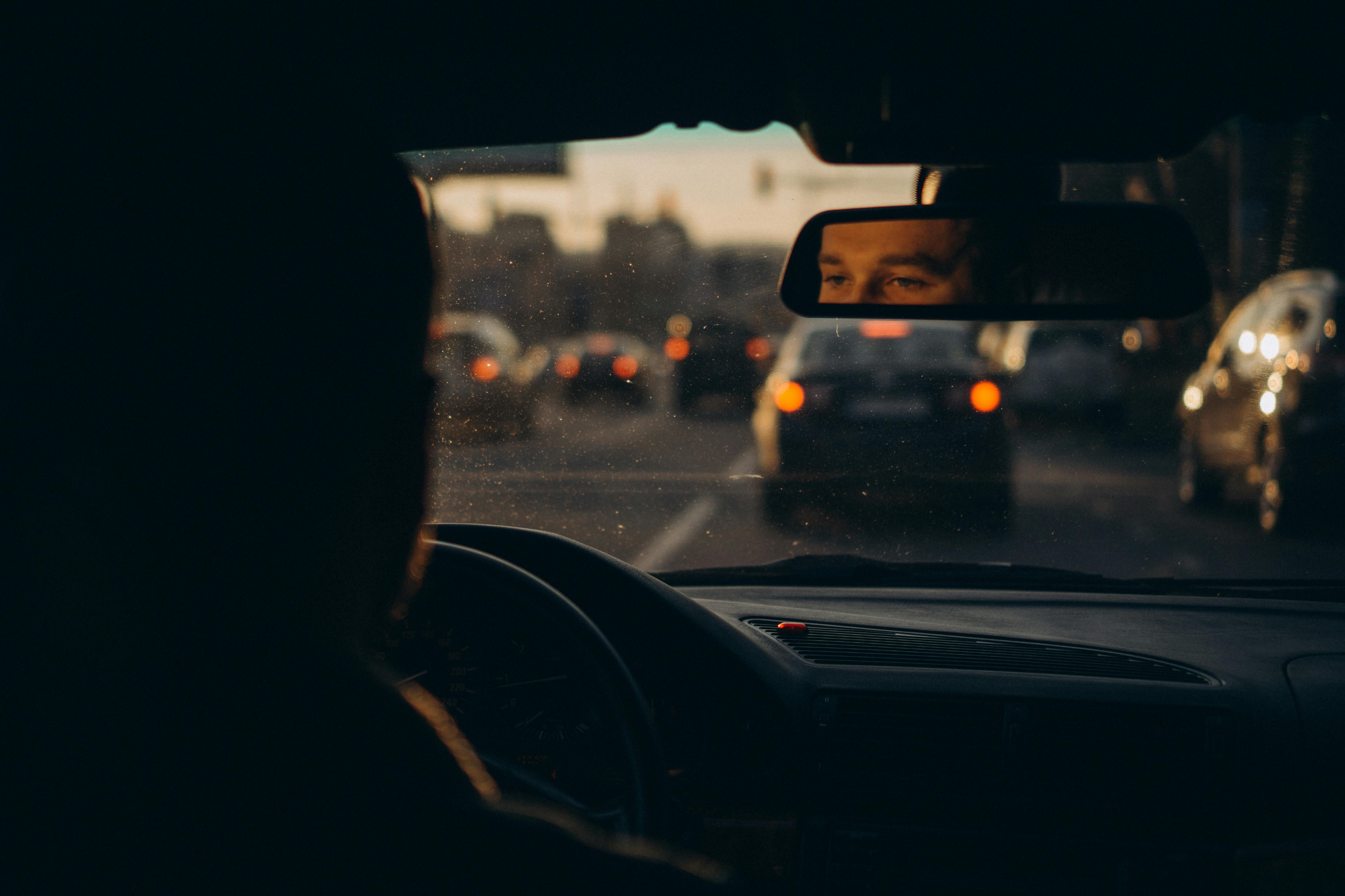 Man Driving in Traffic · Free Stock Photo