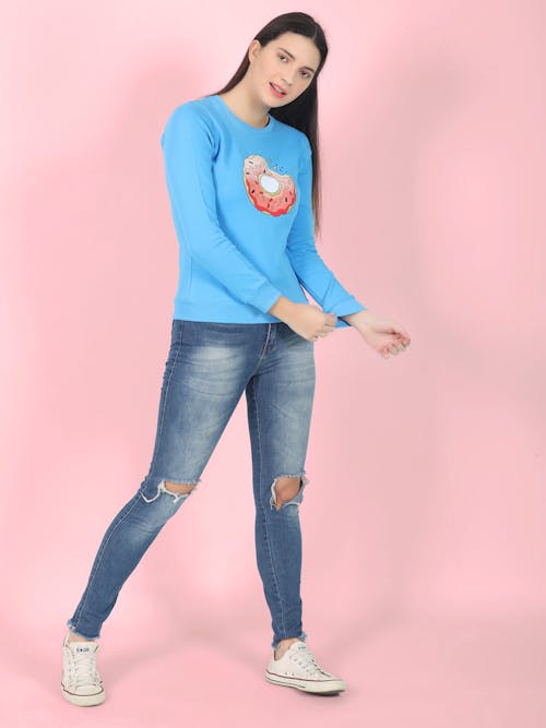 Young Woman Posing on Pink Studio Background