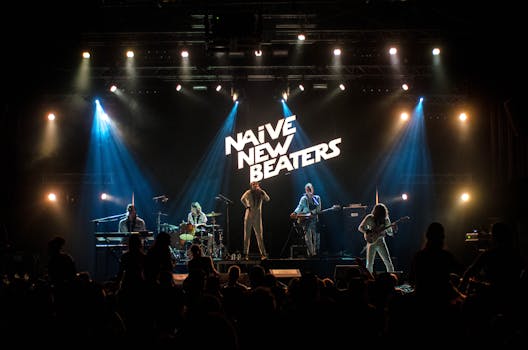 A vibrant live performance by a band on stage with dramatic lighting and engaging crowd.