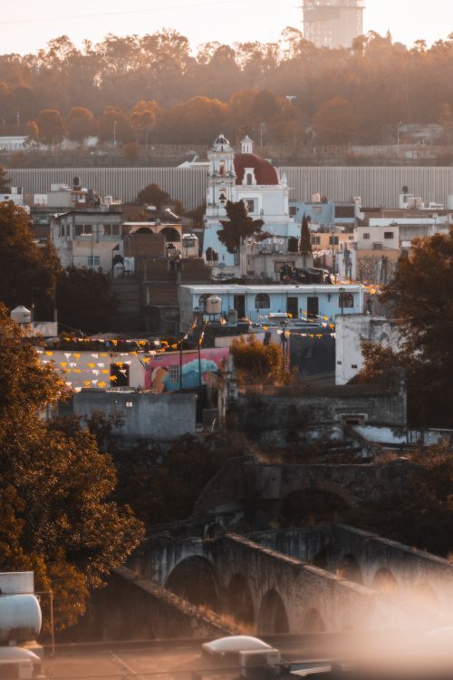 Free Captivating cityscape of Puebla with historic architecture and early sunlight. Stock Photo