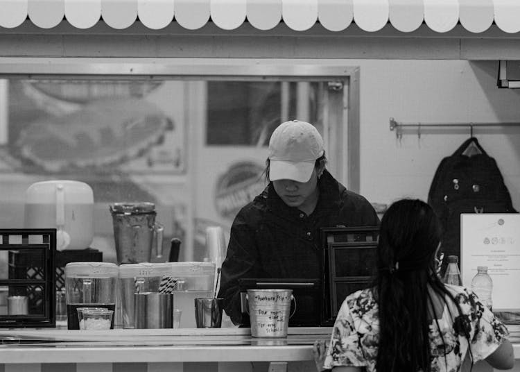 Woman Ordering At The Restaurant 