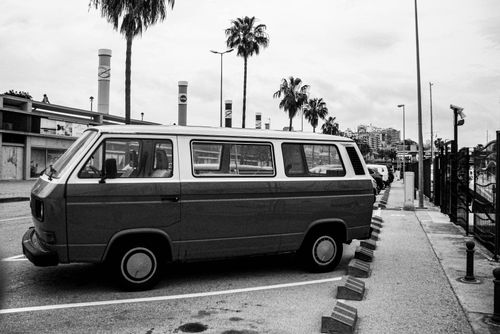 Free Black and white photo of a Volkswagen T1 van parked in a Spanish city. Urban lifestyle captured. Stock Photo