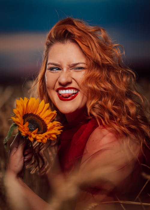 Redhead Woman with Sunflower