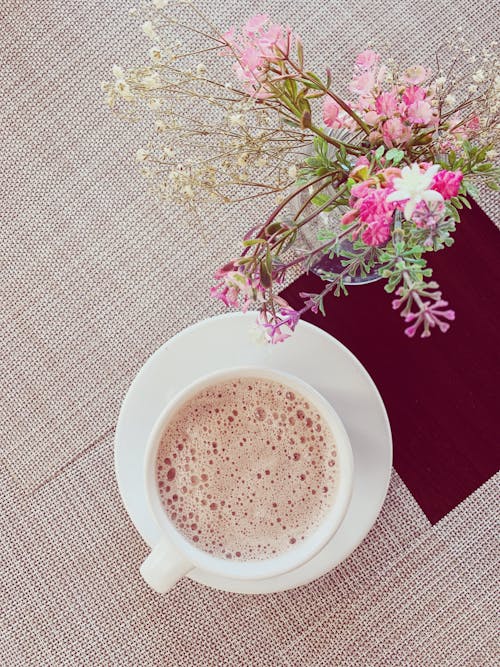 Cup of Coffee and a Bouquet of Flowers 