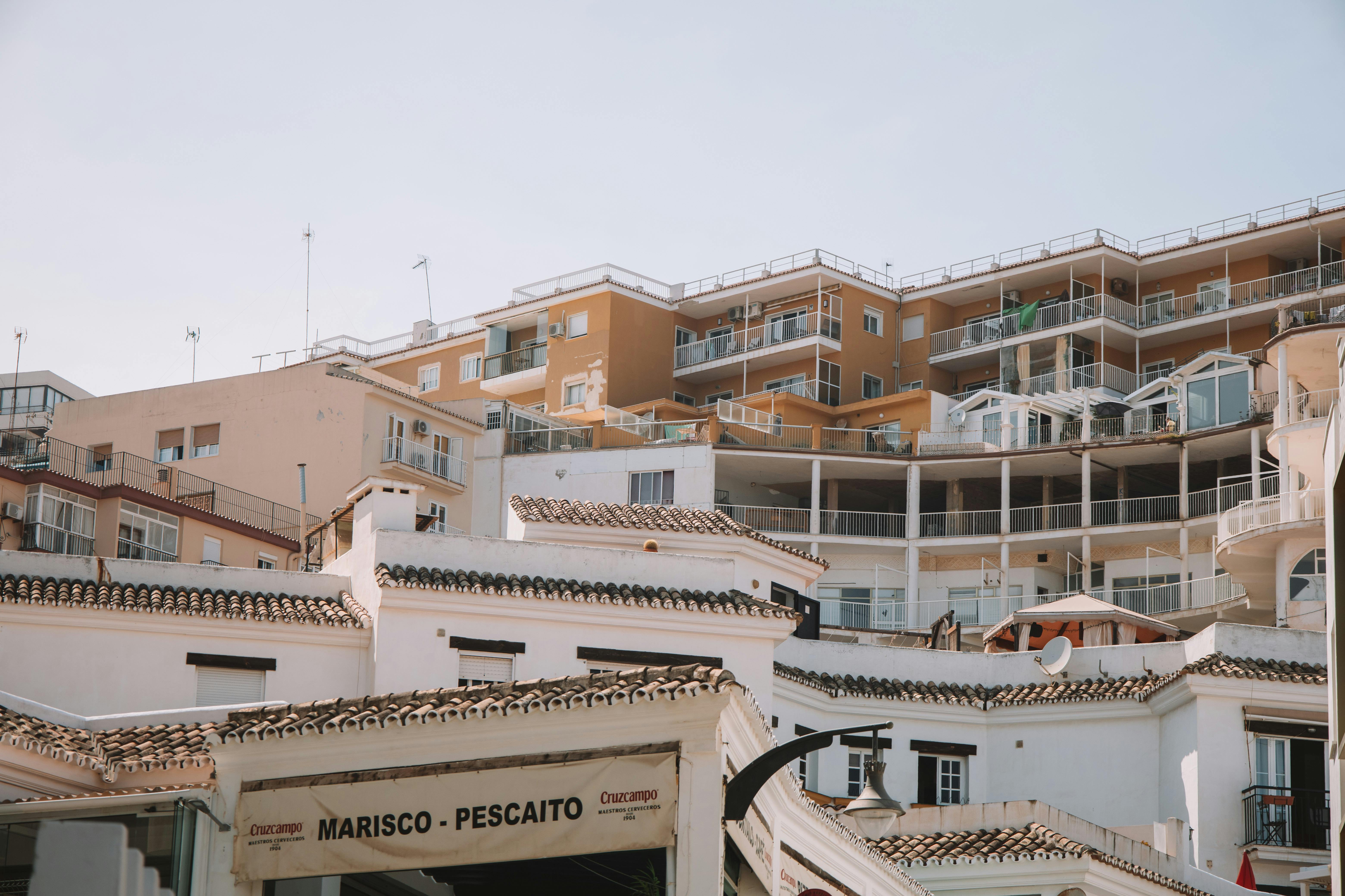 Low angle view of residential buildings and balconies in Málaga, Spain.