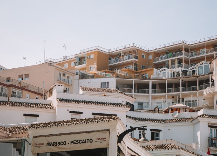 Low angle view of residential buildings and balconies in Málaga, Spain.
