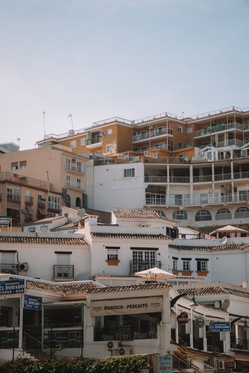 Free A charming view of whitewashed buildings in the historic town of Málaga, Spain, under a clear blue sky. Stock Photo