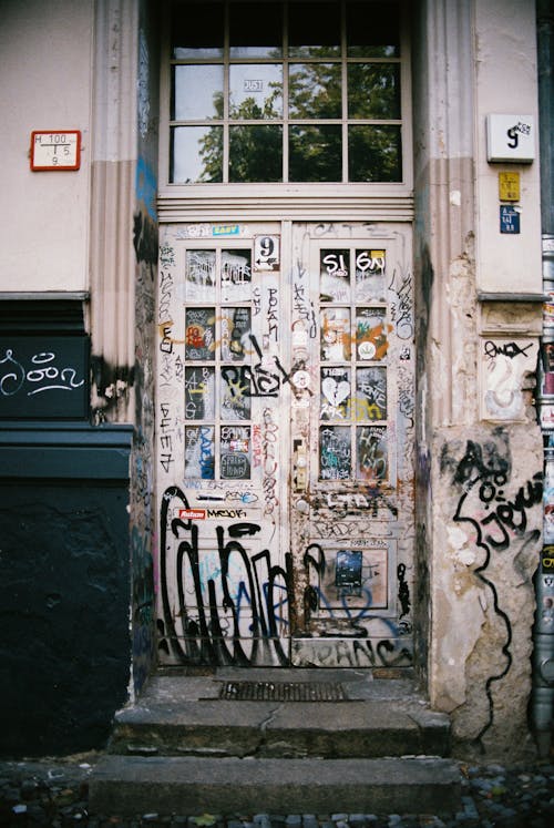 Entrance to an Abandoned Building Covered in Graffiti 
