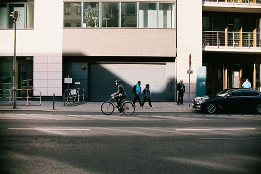 A cyclist crossing a city street — photo by Aliaksei Lepik on Pexels