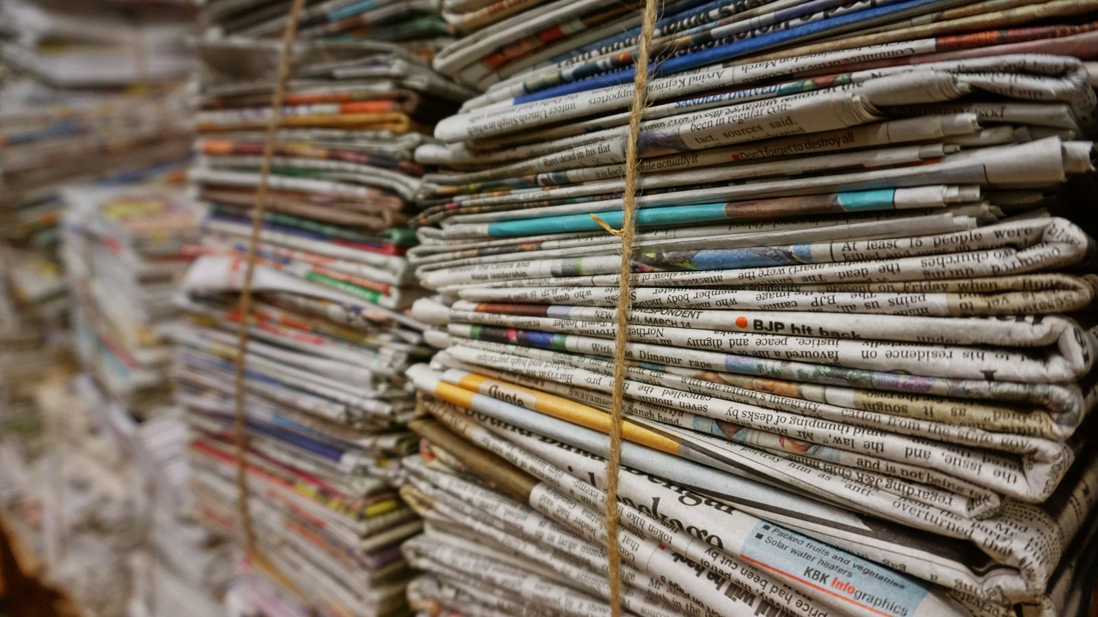 Stacked newspapers tied with twine, a real stock photo with no people in the frame, chosen for Ink, Danny Boyle's film about Rupert Murdoch launching The Sun tabloid