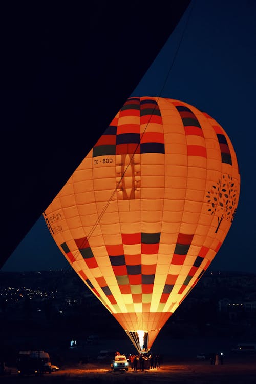An Illuminated Hot Air Balloon on the Ground 