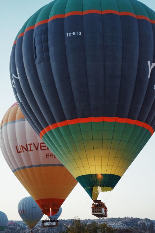 Free Majestic hot air balloons soaring against a clear blue sky, capturing a sense of adventure. Stock Photo