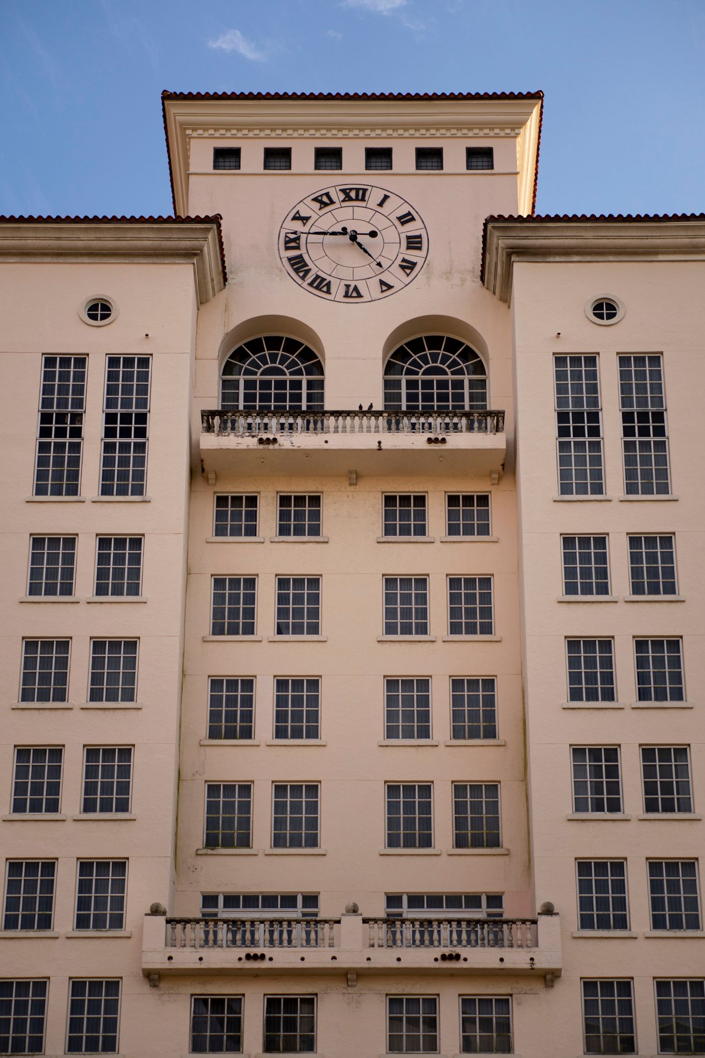 Mediterranean Revival building facade with clock tower, Coral Gables