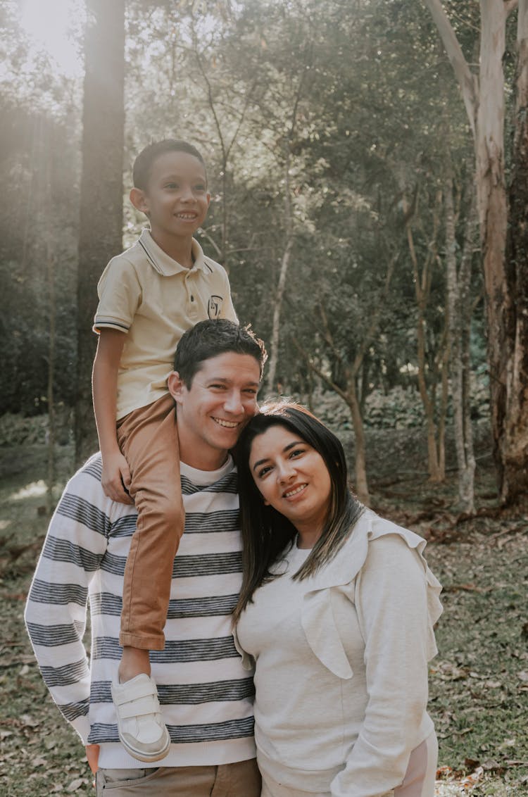 Mother And Father Posing With Son