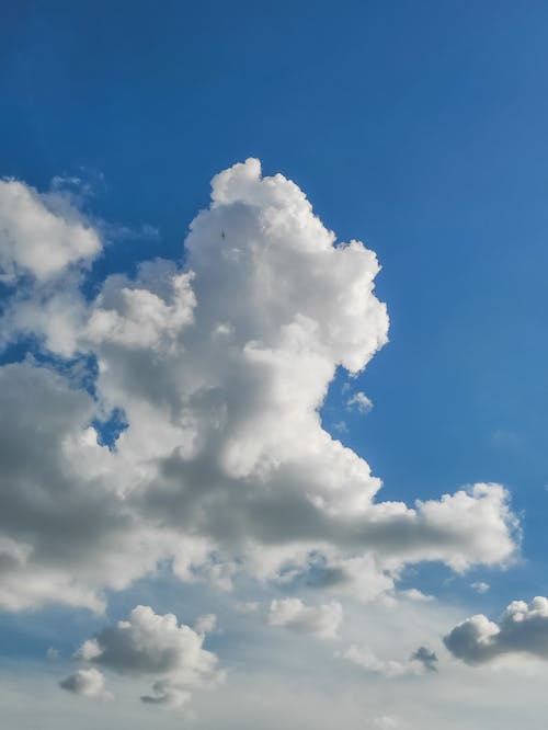 Fluffy White Clouds in Blue Sky