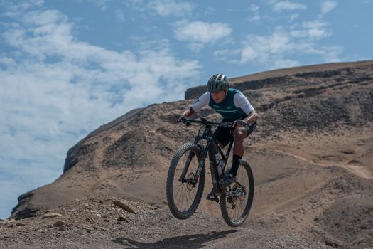 Cyclist Going Downhill a Mountain