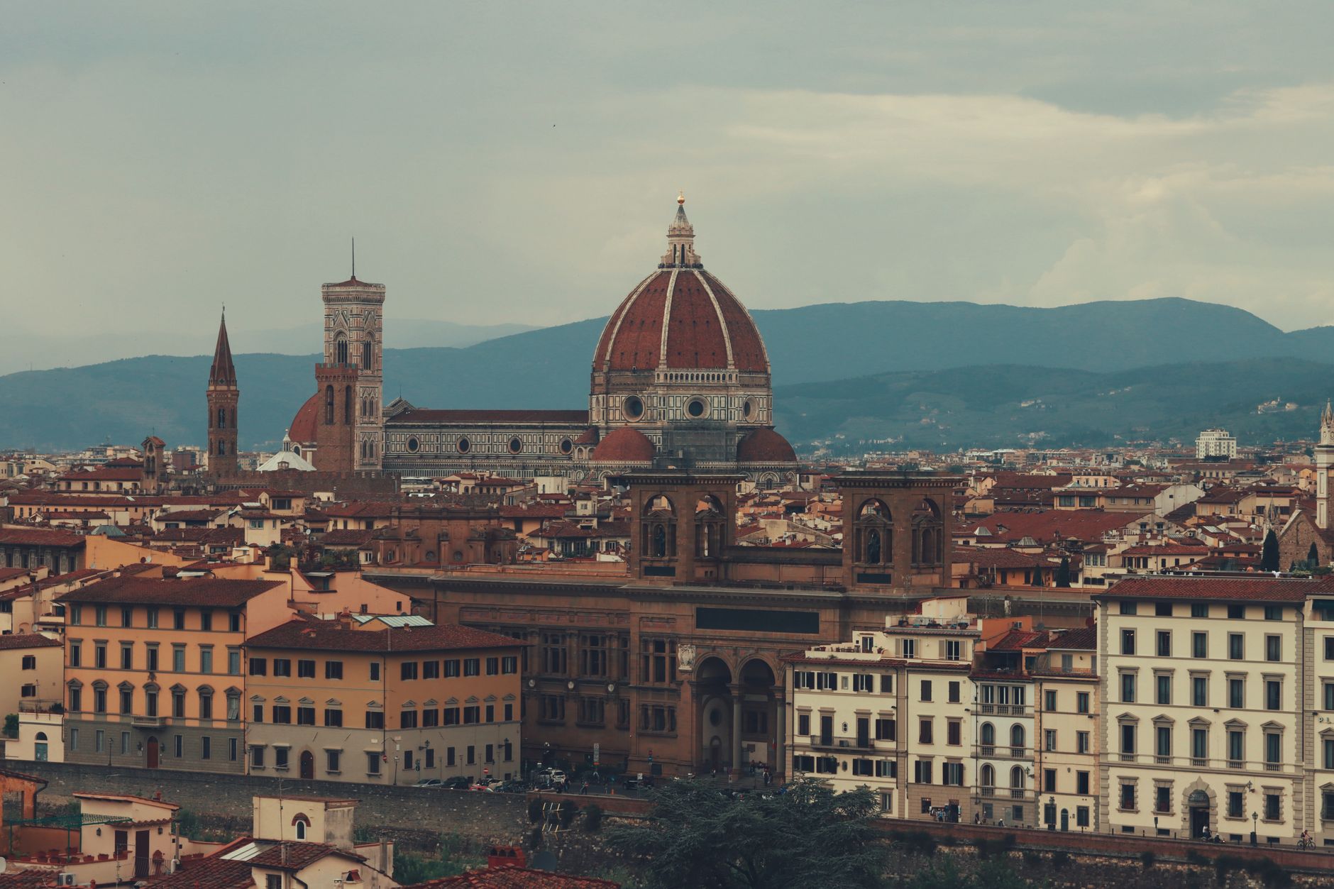 Florence Spring Panorama Panoramic view of Florence cityscape with Duomo and Arno River under a clear blue sky in spring.