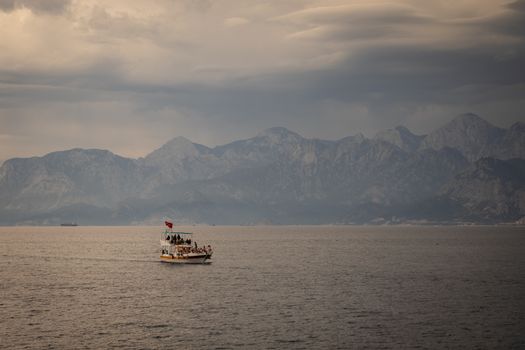 Motorboat near Mountains on Coast