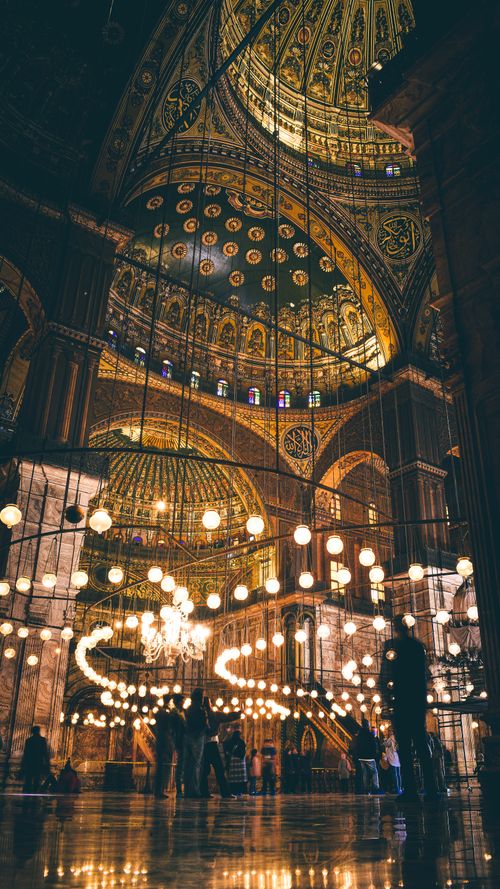 Free Explore the illuminated and ornamented interior of the historic Hagia Sophia, a notable Islamic landmark. Stock Photo