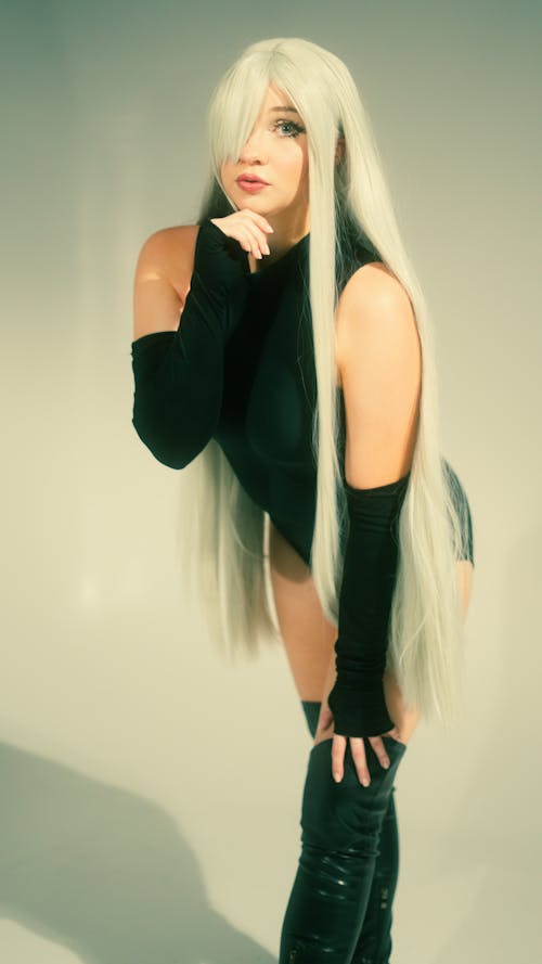 Woman with Blonde, Dyed Hair Posing in Black Clothes