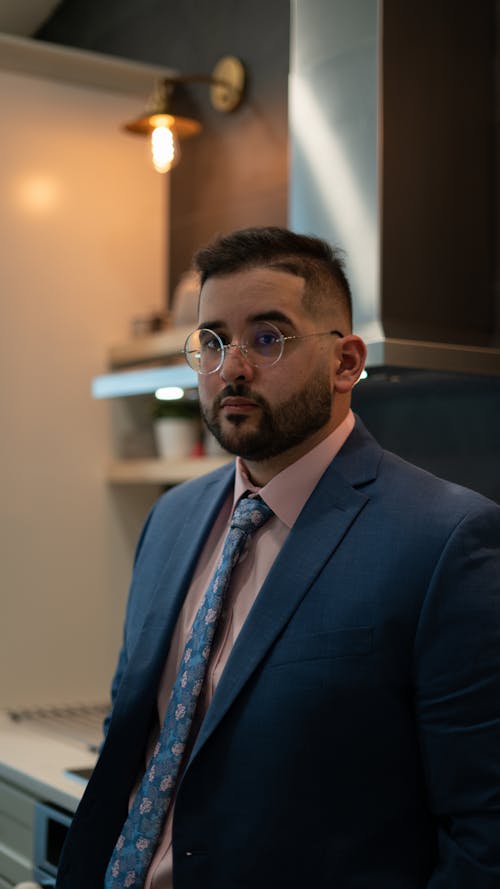 Man in Blue Suit and Pink Shirt