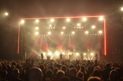 Band playing to a lit crowd — photo by Thibault Trillet on Pexels