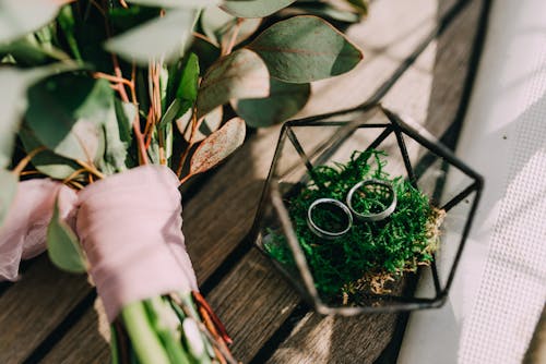Free Rings Beside A Bouquet Stock Photo