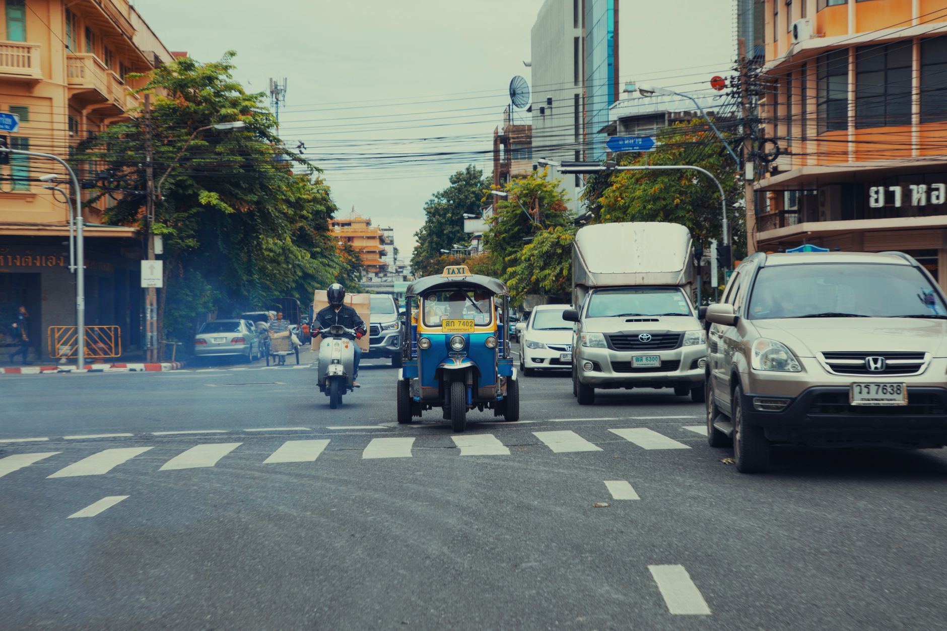 Empty Bangkok street shimmering in April afternoon heat