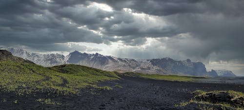 Kostenloses Stock Foto zu arktische landschaft, bewölkter himmel, dramatische landschaft